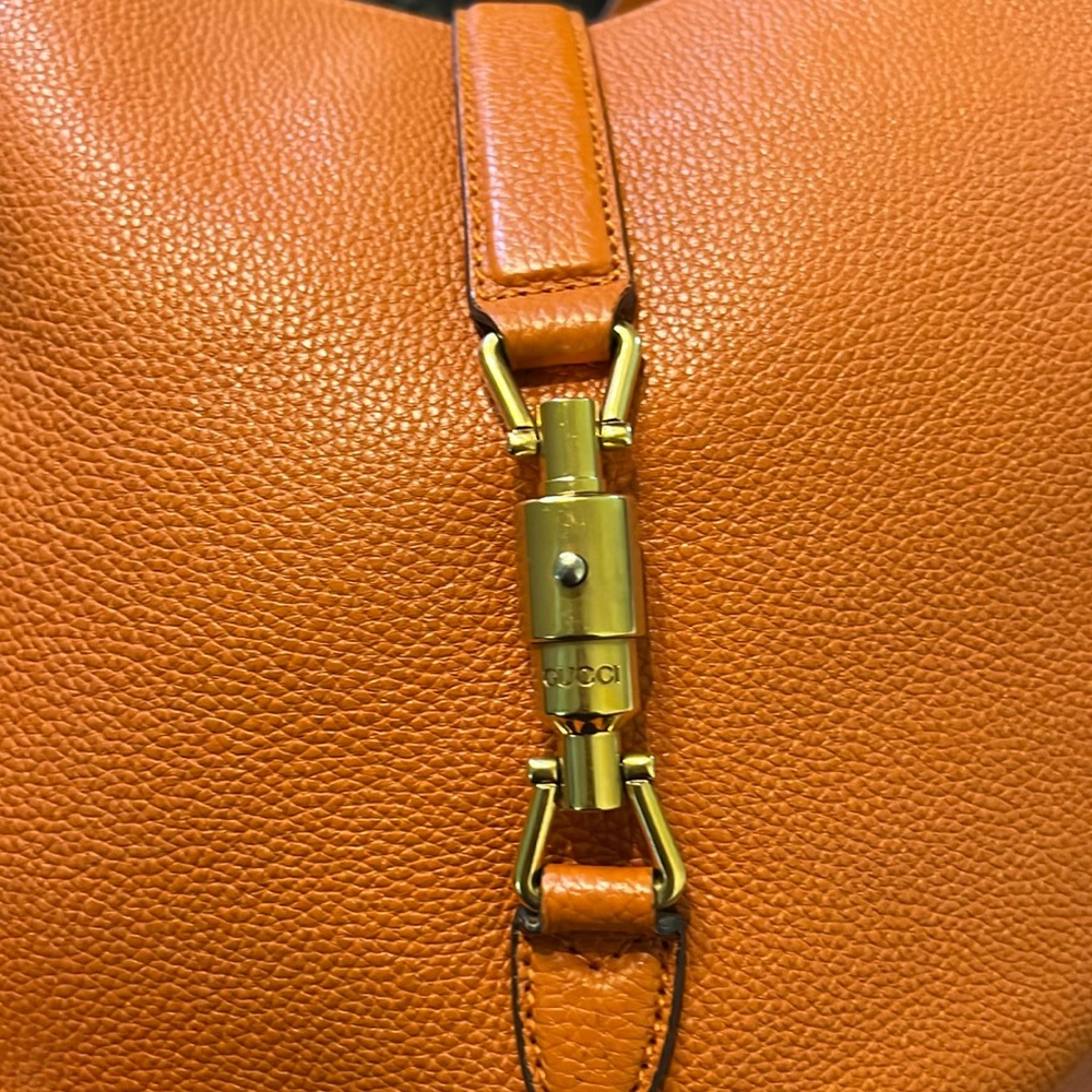 Authentic leather Gucci bag with pouch and extra strap.